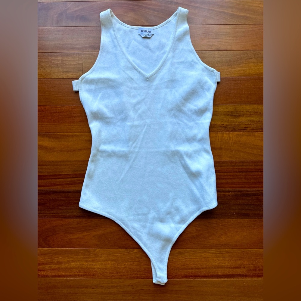 Bebe white bodysuit with back/side cut outs size XL knit